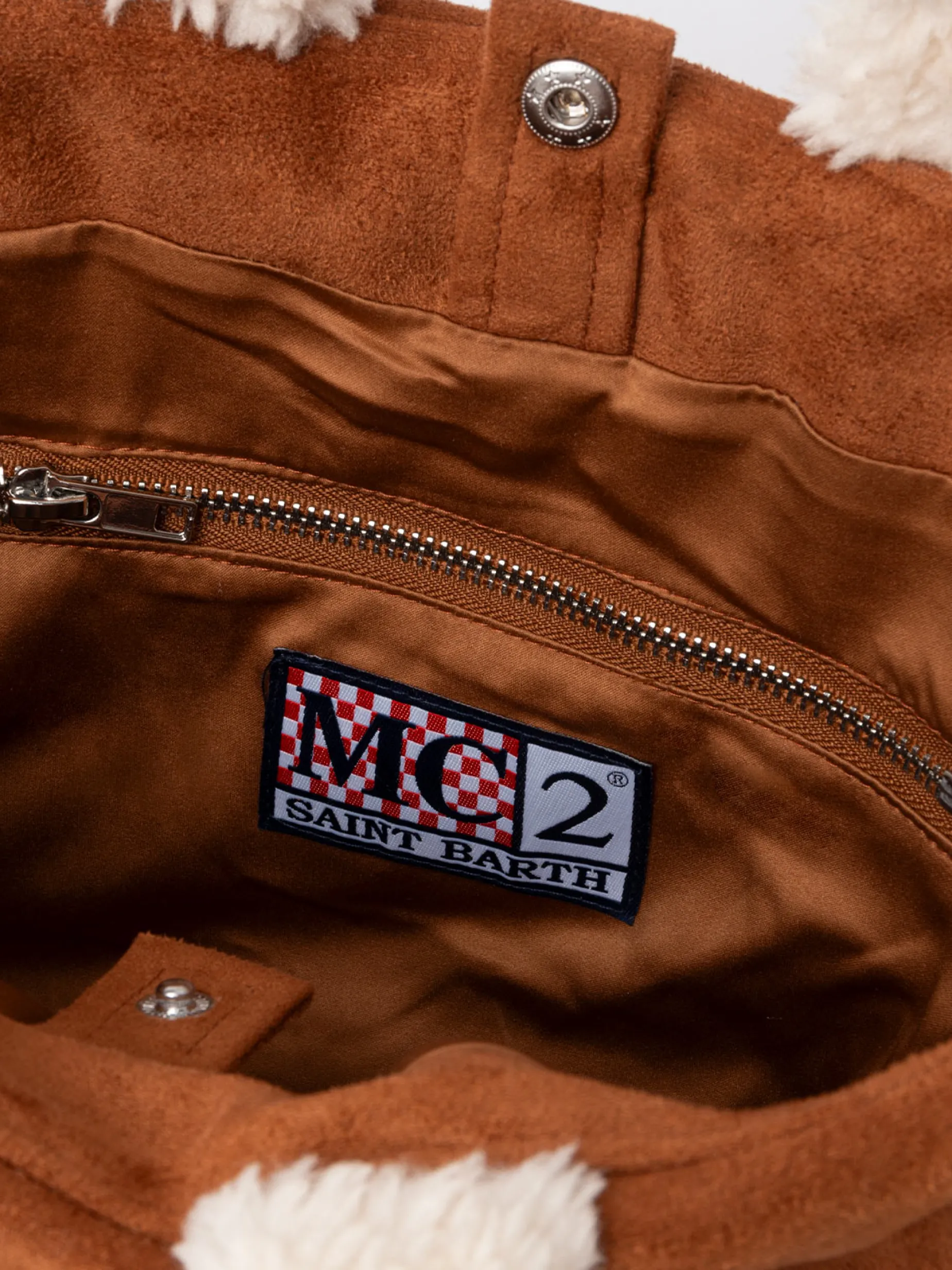 Borsa piccola morbida in pelle di montone color cammello con logo Saint Barth e tracolla